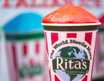 A close-up of a red Rita's water ice.