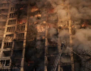 APTOPIX Russia Ukraine War Ukrainian firefighters work in an apartment building after a bombing in Kyiv, Ukraine, Tuesday, March 15, 2022. (AP Photo/Felipe Dana)