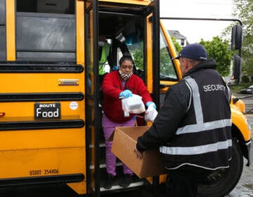 Nutritionist Shaunté Fields and bus driver Treva White (left) deliver meals to children and their families