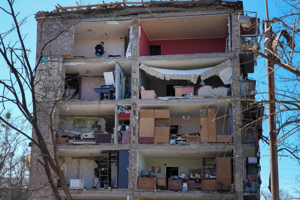 A man walks in his apartment ruined after the Russian shelling in Kyiv