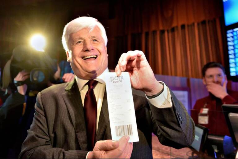 Sen. Tommy Tomlinson holds a sports betting ticket from Parx Casino.