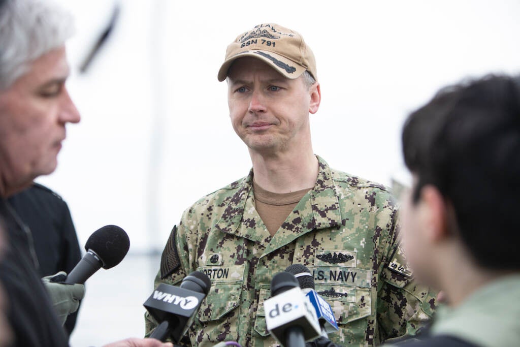 USS Delaware Captain Matthew Horton talks about his ship during the dress rehearsal for the official commission ceremony for the new submarine.