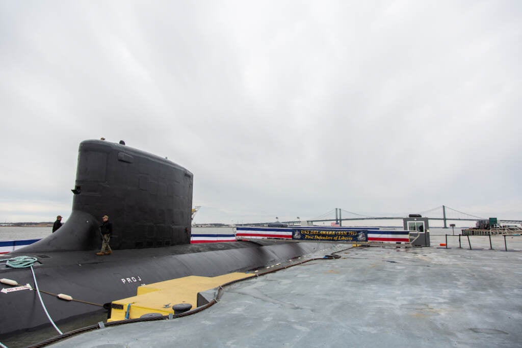 The deck of the brand new U.S.S. Delaware submarine is visible.