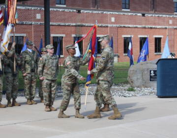 Maj. Gen. Rodney Faulk, commanding general of the Army Reserve's 99th Readiness Division based at Joint Base McGuire-Dix-Lakehurst, passing the colors to Command Sgt. Maj. Subretta Pompey as she assumes the assignment as the top non-commissioned officer in the division. She is also the first African American and first woman to hold that position.