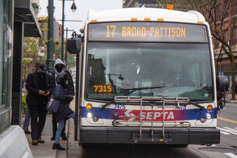 SEPTA riders board a bus in Center City, Philadelphia, on April 19, 2022. (Kimberly Paynter/WHYY)