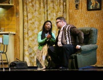 Gilda (Raven McMillan) pleads with her father, Rigoletto (Anthony Clark Evans), who confines her to the house under the watch of a housekeeper. (Emma Lee/WHYY)