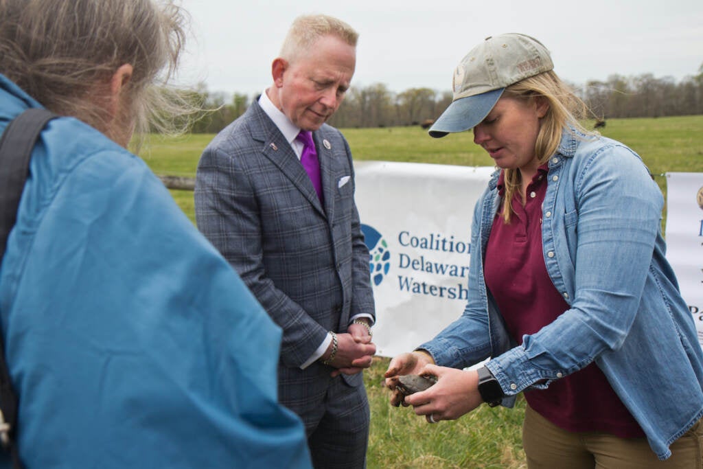 U.S. Rep. Jeff Van Drew meets a bog turtle held by Kristen Meistrel