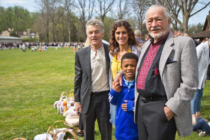 A family poses together for a photo at the Ukrainian Orthodox Church's Easter celebration in Jenkintown, Pa.