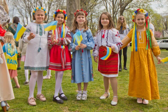 A group of girls pose for a photo wearing traditional Ukrainian outfits.