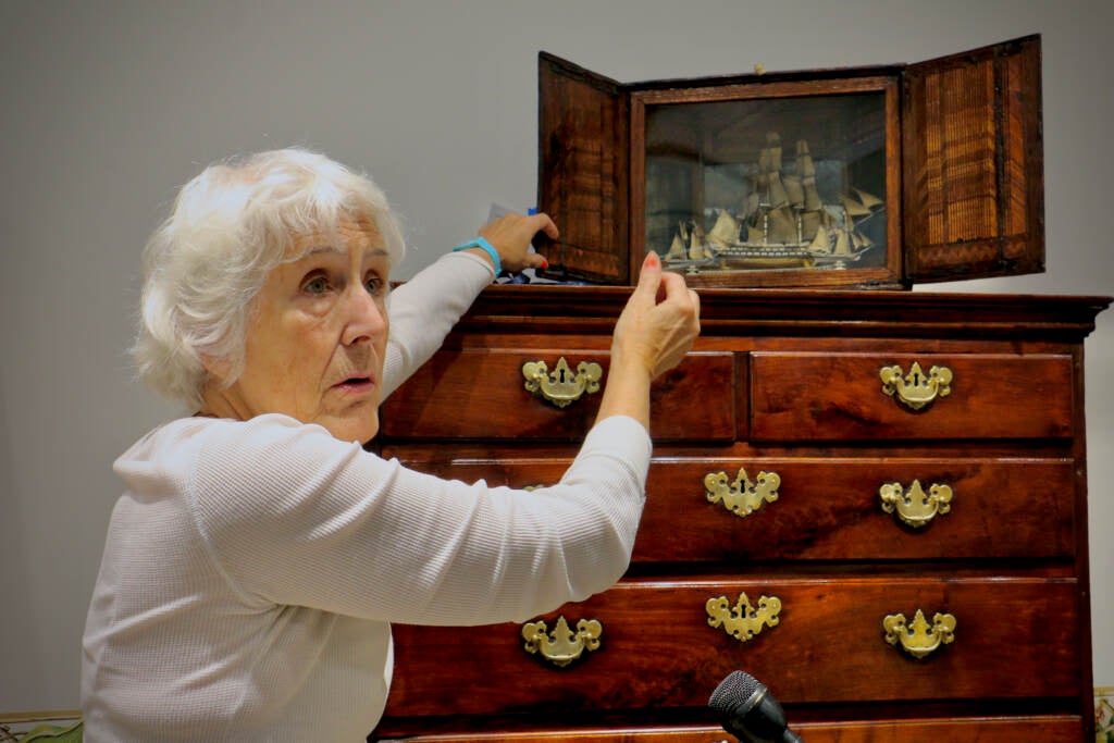 Diana Bittel shows off a work of art created using carved soup bones