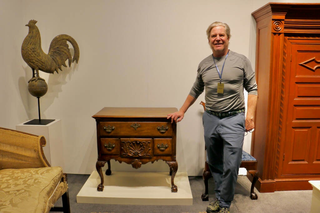 Jeffrey Tillou shows off an 18th century tiger maple dressing table