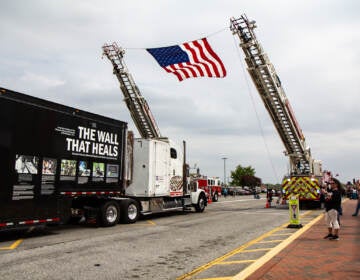 Students and teachers cheer as The Wall That Heals arrives at William Penn High School in New Castle, Del., on April 26, 2022. (Kimberly Paynter/WHYY)