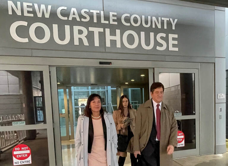 Delaware Auditor Kathy McGuiness leaves court Thursday with her attorney, Steve Wood. (Cris Barrish/WHYY)