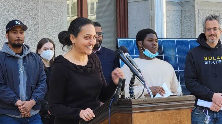 Nidhi Krishen speaks from a podium