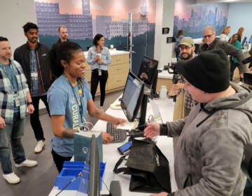 Justin Dugarry makes first legal purchase of recreational marijuana at Curealeaf Bellmawr. (Tom MacDonald / WHYY)