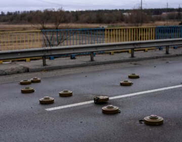 Anti tank mines are displayed on a bridge in Bucha, in the outskirts of Kyiv, Ukraine, Saturday, April 2, 2022. (AP Photo/Rodrigo Abd)