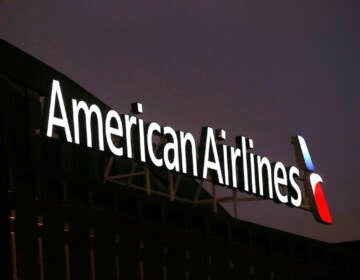 The American Airlines logo on top of the American Airlines Center, prior to an NHL hockey game between the Washington Capital and Dallas Stars, in Dallas, Texas on December 19, 2017. (AP Photo/ Michael Ainsworth)