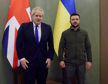 In this image provided by the Ukrainian Presidential Press Office, Ukrainian President Volodymyr Zelenskyy (right) and Britain's Prime Minister Boris Johnson pose for a picture during their meeting in Kyiv, Ukraine, Saturday, April 9, 2022. (Ukrainian Presidential Press Office via AP)