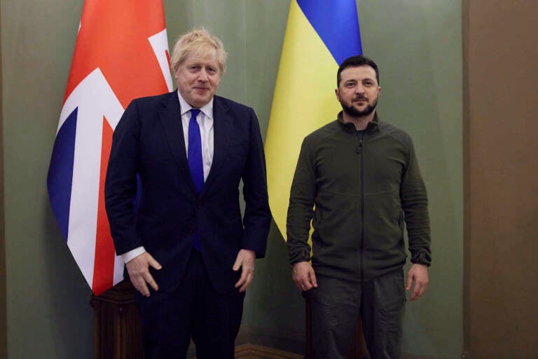 In this image provided by the Ukrainian Presidential Press Office, Ukrainian President Volodymyr Zelenskyy (right) and Britain's Prime Minister Boris Johnson pose for a picture during their meeting in Kyiv, Ukraine, Saturday, April 9, 2022. (Ukrainian Presidential Press Office via AP)