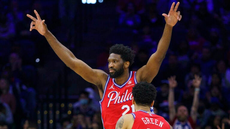 Philadelphia 76ers' Joel Embiid (left) reacts to the basket by Danny Green, during the first half of an NBA basketball game against the Indiana Pacers, Saturday, April 9, 2022, in Philadelphia. (AP Photo/Chris Szagola)