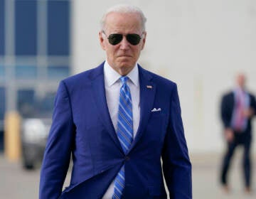 President Joe Biden walks to speak to reporters before boarding Air Force One at Des Moines International Airport, in Des Moines Iowa, Tuesday, April 12, 2022, en route to Washington. (AP Photo/Carolyn Kaster)