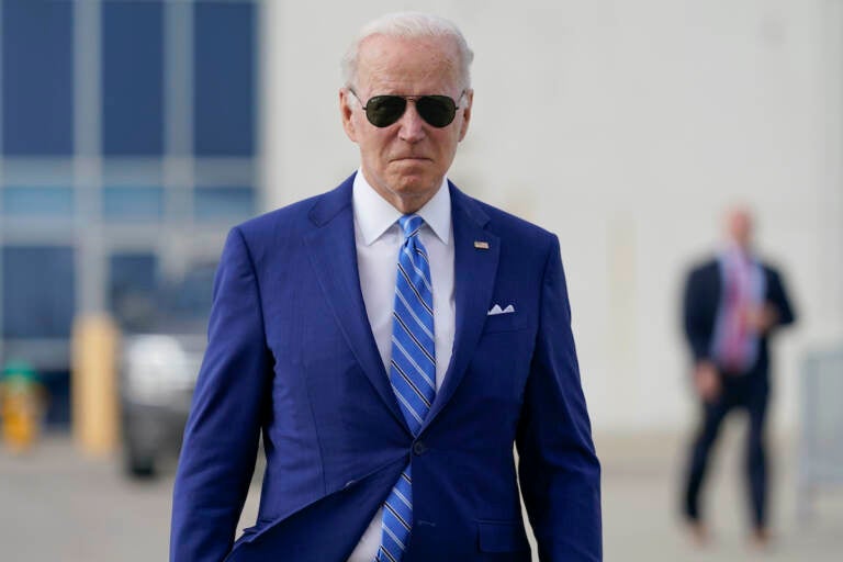 President Joe Biden walks to speak to reporters before boarding Air Force One at Des Moines International Airport, in Des Moines Iowa, Tuesday, April 12, 2022, en route to Washington. (AP Photo/Carolyn Kaster)