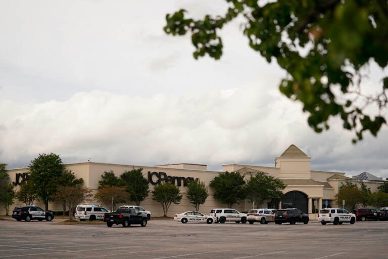 Authorities stage in a parking lot at Columbiana Centre mall in Columbia, S.C., following a shooting, Saturday, April 16, 2022. (AP Photo/Sean Rayford)