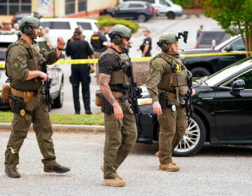 Authorities stage outside Columbiana Centre mall in Columbia, S.C., following a shooting, Saturday, April 16, 2022.