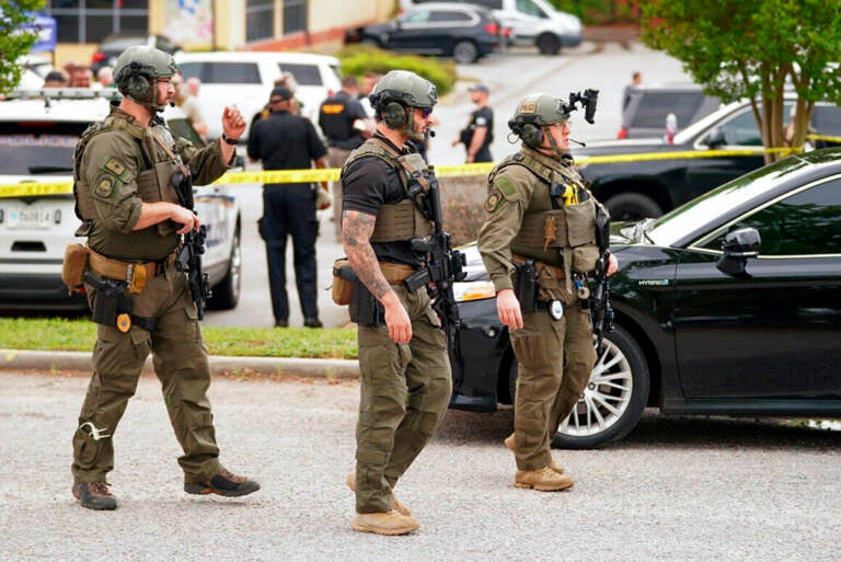 Authorities stage outside Columbiana Centre mall in Columbia, S.C., following a shooting, Saturday, April 16, 2022.