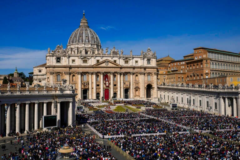 Faithful gather to attend the Catholic Easter Sunday mass led by Pope Francis in St. Peter's Square at the Vatican, Sunday, April 17, 2022. For many Christians, this weekend marks the first time in three years they will gather in person to celebrate Easter Sunday.