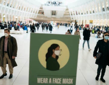 Mass transit riders wear masks as they commute in the financial district of lower Manhattan, Tuesday, April 19, 2022, in New York. U.S. District Judge Kathryn Kimball Mizelle in Tampa, Fla., on April 18, 2022, voided the national travel mask mandate as exceeding the authority of U.S. health officials. The mask mandate that covers travel on airplanes and other public transportation was recently extended by President Joe Biden's administration until May 3