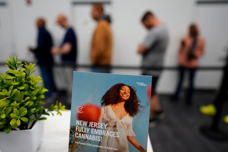 Customers line up inside a Curaleaf dispensary, Thursday, April 21, 2022, in Bellmawr, N.J. Recreational sales of cannabis for adults 21 and older started Thursday, with the first alternative treatment centers opening at 6 a.m. in part of the state. (AP Photo/Matt Slocum)