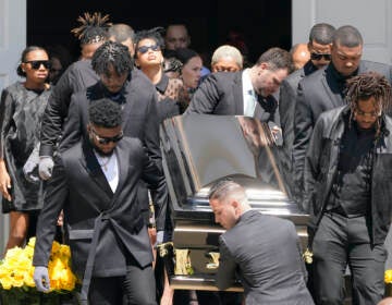 Pallbearers carry the casket of Pittsburgh Steelers NFL football player Dwayne Haskins from a memorial service, Friday, April 22, 2022, in Pittsburgh. (AP Photo/Keith Srakocic)