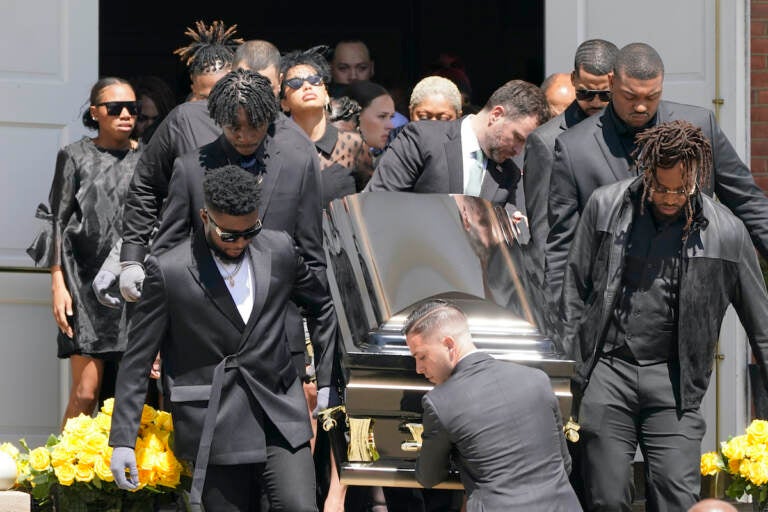 Pallbearers carry the casket of Pittsburgh Steelers NFL football player Dwayne Haskins from a memorial service, Friday, April 22, 2022, in Pittsburgh. (AP Photo/Keith Srakocic)