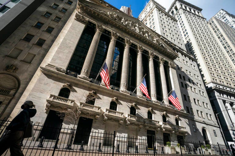 A pedestrian passes the New York Stock Exchange, Monday, Jan. 24, 2022, in New York. (AP Photo/John Minchillo)