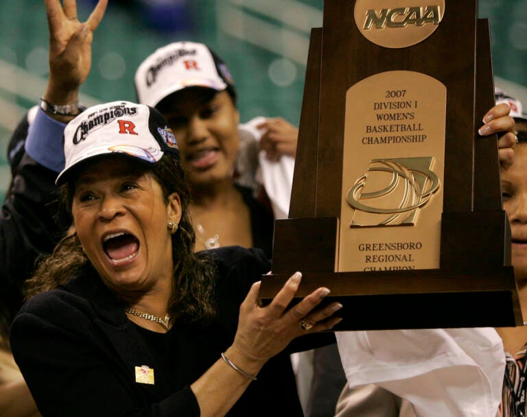 File photo: Rutgers coach C. Vivian Stringer holds the trophy after Rutgers defeated Arizona State 64-45 in the regional final of the NCAA women's basketball tournament in Greensboro, N.C., Monday, March 26, 2007. Stringer has announced her retirement, Saturday, April 30, 2022, after 50 years in college basketball. She finished with 1,055 wins, fourth all-time among Division I women’s basketball coaches.