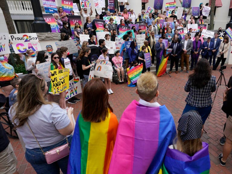 Demonstrators gather on the steps of the Florida Historic Capitol Museum in front of the Florida State Capitol, March 7, 2022, in Tallahassee, Florida/