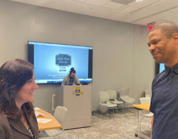 Public defender Lisa Minutola and community engagement specialist Corie Priest guided people through the expungement process. (Cris Barrish/WHYY)