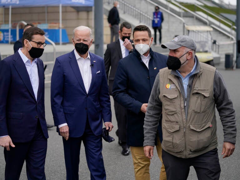 Celebrity chef José Andrés (right) is the founder of World Central Kitchen, a nonprofit organization that serves meals to people affected by humanitarian crises. Here, President Biden (second from left) arrives to meet with Ukrainian refugees and humanitarian aid workers during a visit to Warsaw, Poland, on March 26. (Evan Vucci/AP)