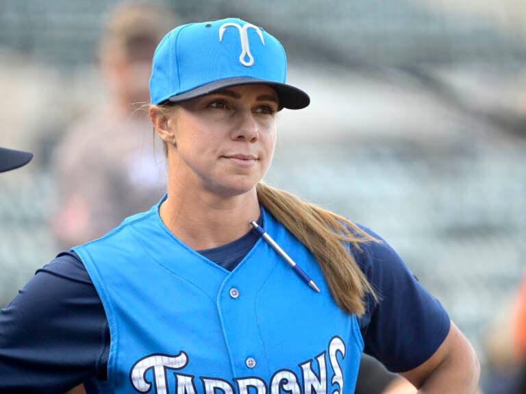 Tampa Tarpons manager Rachel Balkovec watches from the top steps of the dugout, while making her debut as a minor league manager of the Tarpons, a Single-A affiliate of the New York Yankees, before a baseball game against the Lakeland Flying Tigers, Friday, April 8, 2022, in Lakeland, Fla. Balkovec is the first female to manage a professional baseball team.