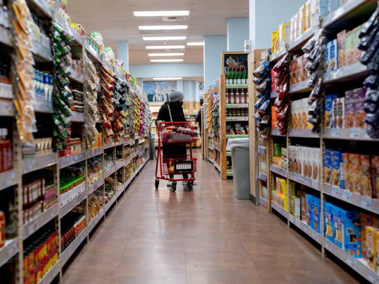 A shopper walks through a grocery store in Washington, D.C, on March 13. Surging inflation poses a particular challenge for working-class families, impacting the cost of basic necessities such as groceries. (Stefani Reynolds/AFP via Getty Images)
