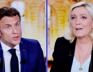 A wide gulf exists between the policies of French President Emmanuel Macron and far-right candidate Marine Le Pen. The two face off Sunday, in the second round of France's national election. (Ludovic Marin/AFP via Getty Images)