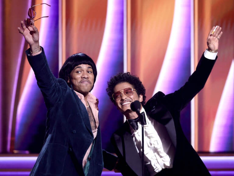 Anderson Paak (left) and Bruno Mars accept the Record of the Year award at the Grammys