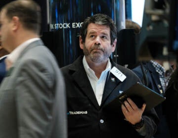 Traders work on the floor of the New York Stock Exchange (NYSE) in New York City on April 28. Stocks sank on Friday, ending a miserable month for Wall Street. (Spencer Platt/Getty Images)
