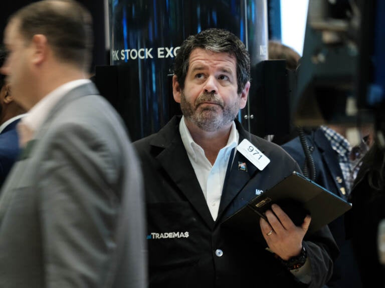 Traders work on the floor of the New York Stock Exchange (NYSE) in New York City on April 28. Stocks sank on Friday, ending a miserable month for Wall Street. (Spencer Platt/Getty Images)
