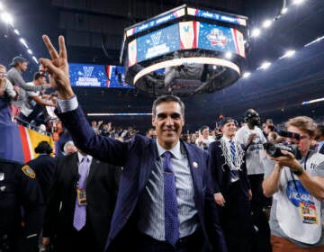 Villanova head coach Jay Wright throws up a peace sign