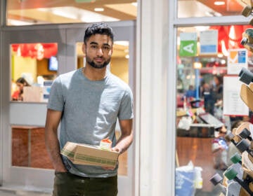 Talha Rafique picks up his to-go suhoor box from a campus dining hall at the University of Southern California. 