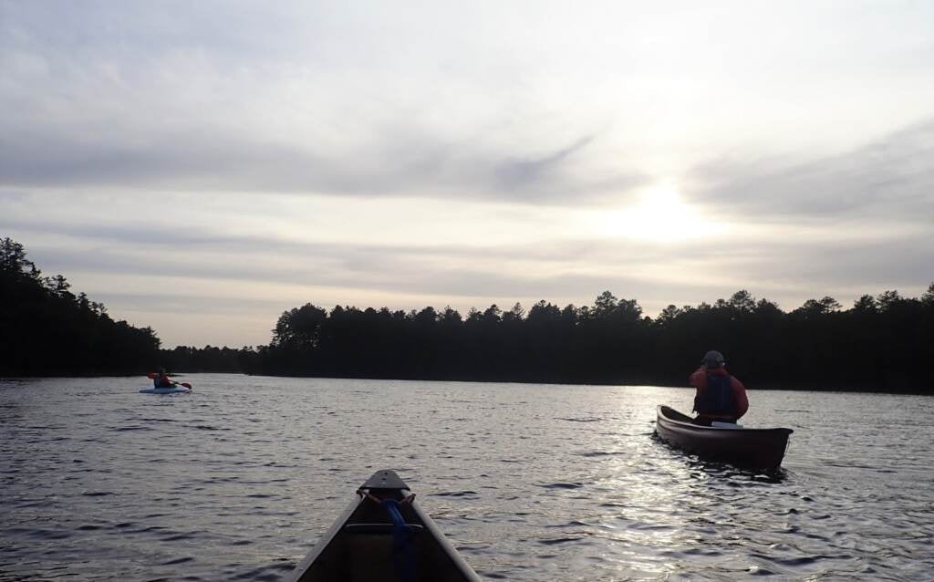 People are seen riding canoes on the Schuylkill River. 