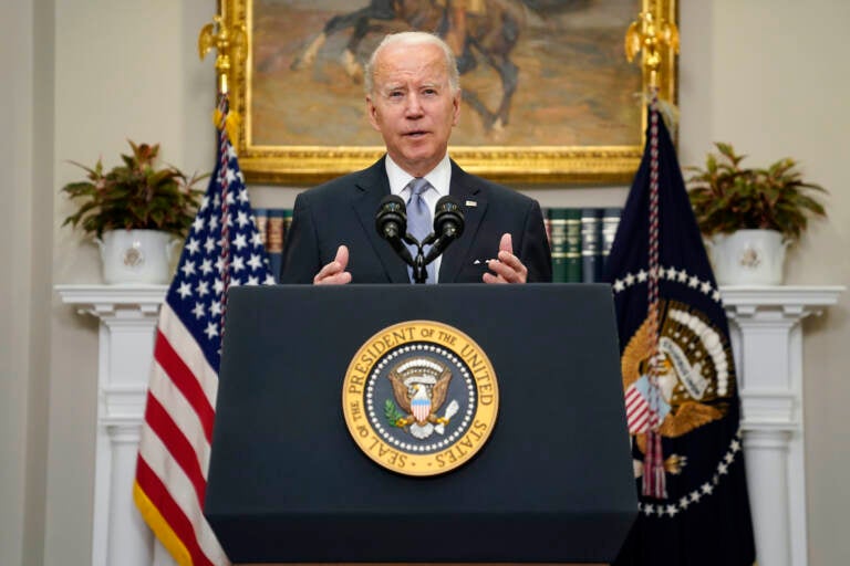 President Joe Biden delivers remarks from a podium at the White House