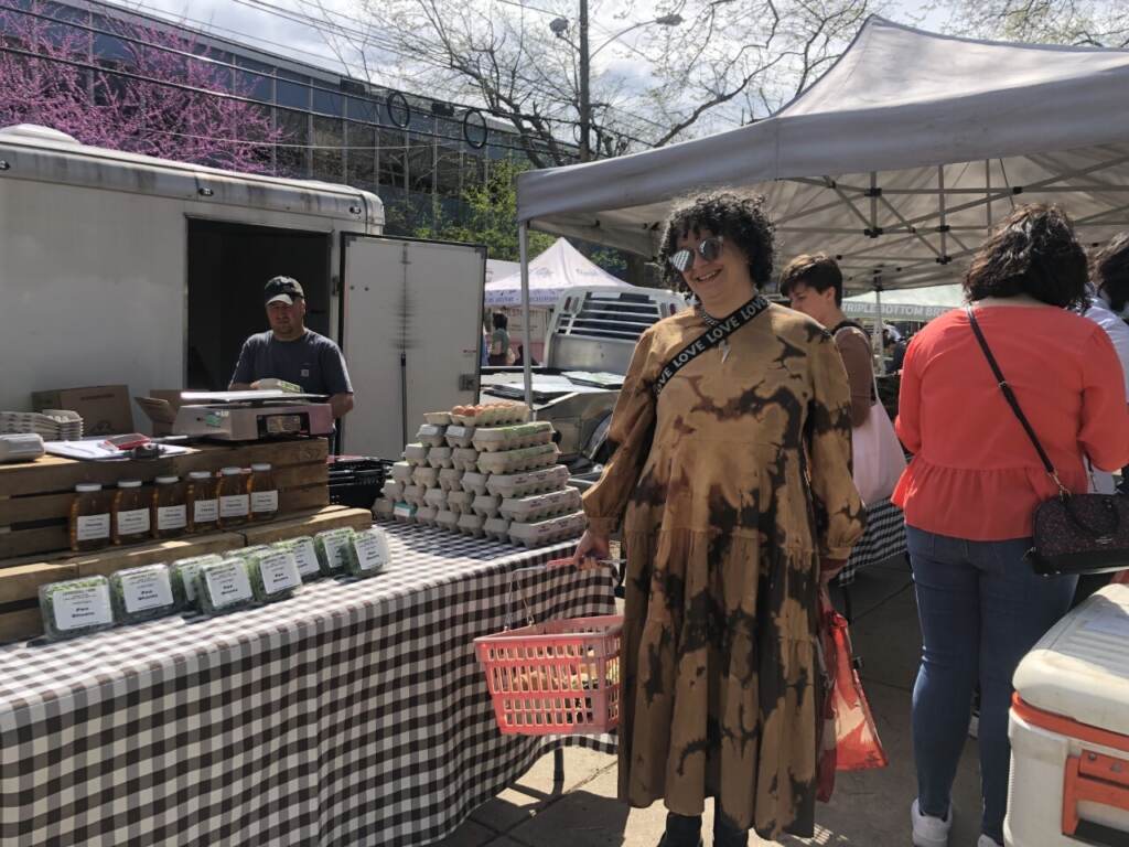 Larisa Mann, a Temple University media studies professor and DJ with a group called Subversion in Philadelphia, said it felt good to see the spring harvest at the Clark Park farmer’s market on Saturday. (Emily Rizzo/WHYY News)